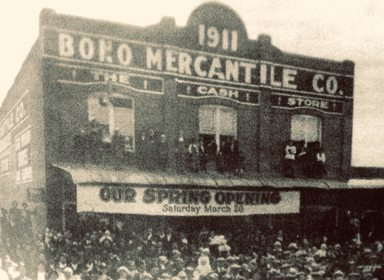Old Picture of People gathered around Old Bono Mercantile Company building.